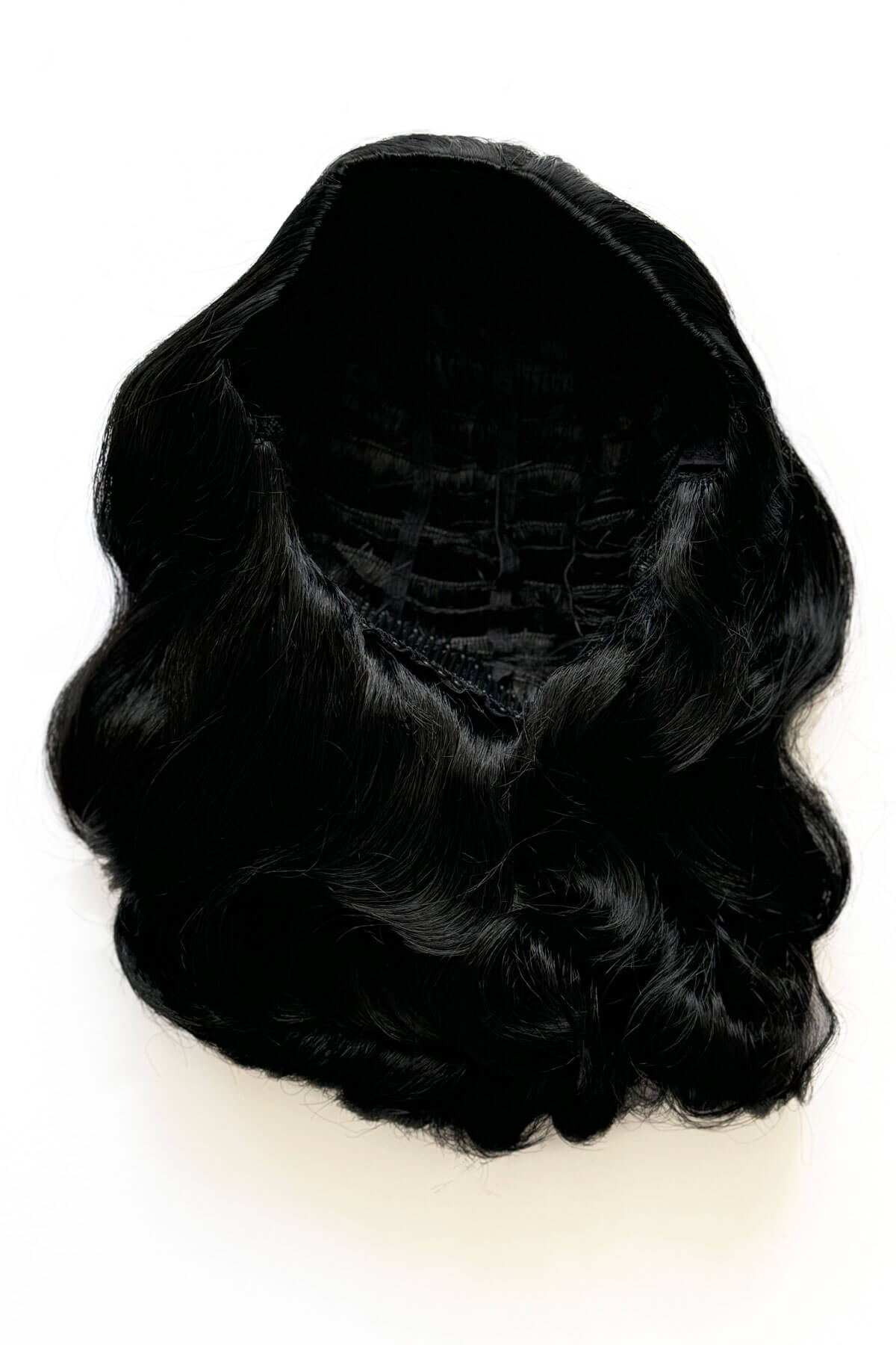 Black wig on a white background. 1950s style shoulder length half wig hairpiece with beautiful vintage waves: Onyx colour jet black 1