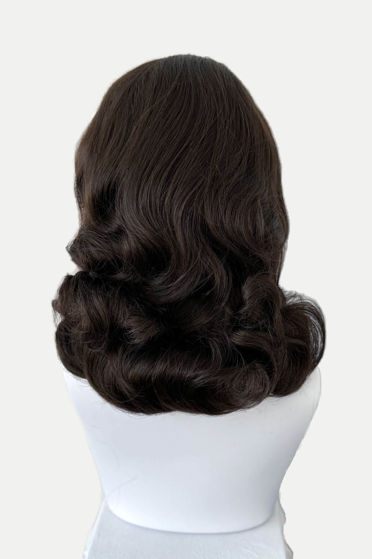Mannequin head with long brown wig on a white background shown from the back. 1950s style shoulder length half wig hairpiece with beautiful vintage waves: Onyx chestnut brown 8 