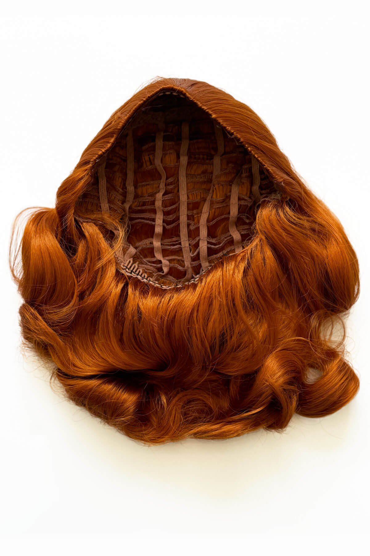 Brown hairpiece on a white background. 1950s style shoulder length half wig hairpiece with beautiful vintage waves: Onyx ginger