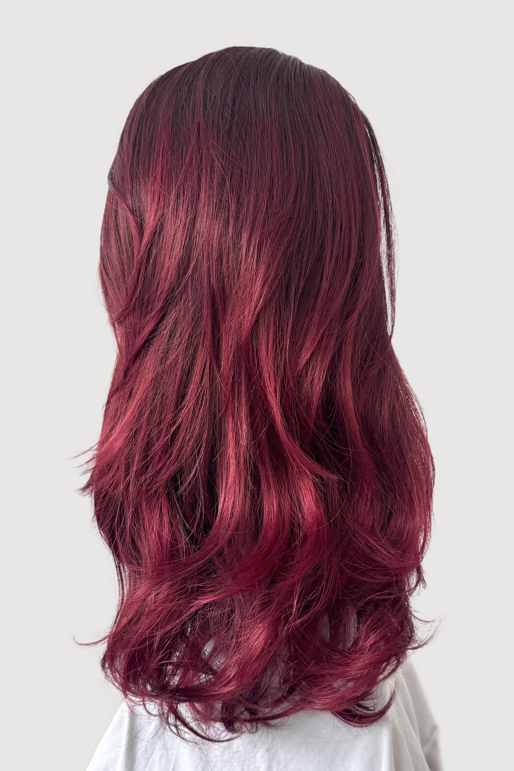 Long, wavy hair with a gradient from dark to light red on a plain background - Mannequin head with burgundy wig on a white background - High crown long, layered half wig and volume ring: Helena 1BT39 Black and red