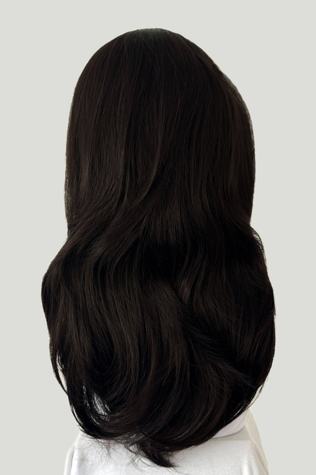 Long, dark brown hair styled in loose waves on a white background. Brown half wig hairpiece, layered and straight: Summer dark brown 4