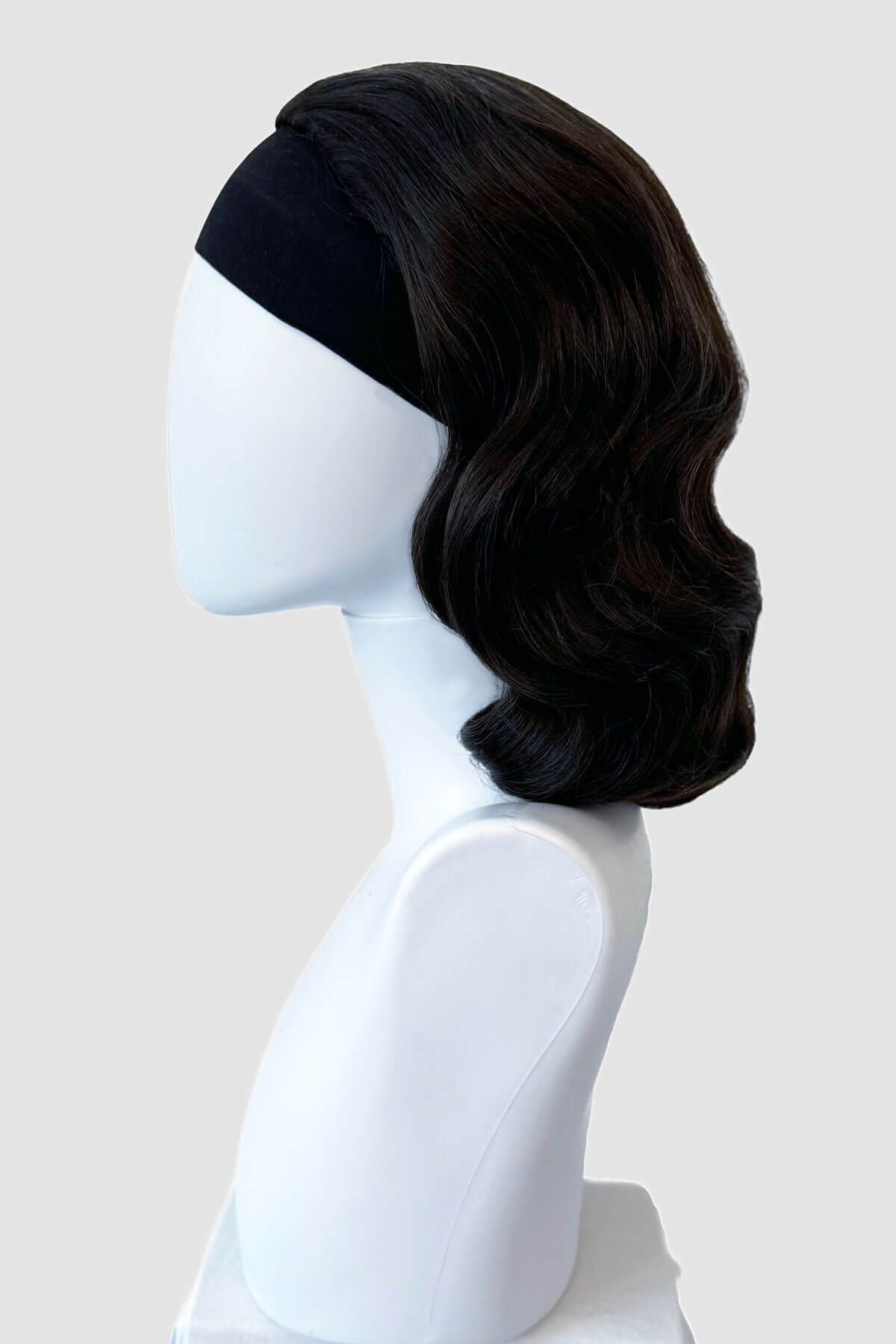Black wig on a mannequin head against a white background. 1940s style half wig hairpiece with beautiful marcel waves: Virginia dark brown 4