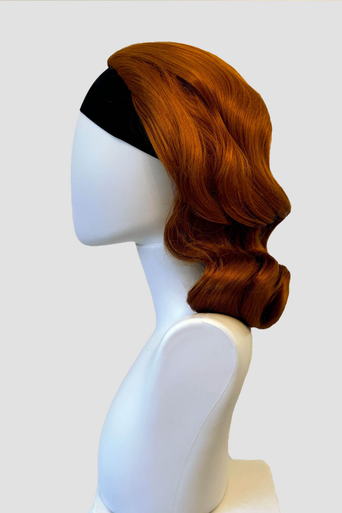 Mannequin with ginger 1940s wig on it. 1940s style half wig hairpiece with beautiful marcel waves: Virginia ginger 
