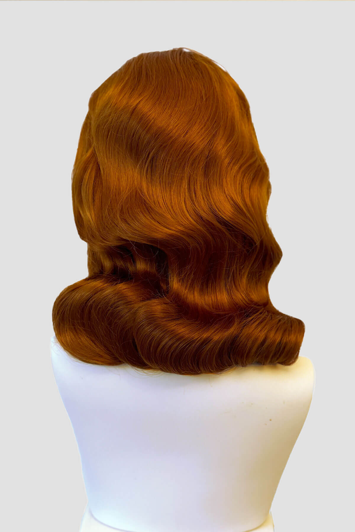 Mannequin with ginger 1940s wig on it. 1940s style half wig hairpiece with beautiful marcel waves: Virginia ginger 