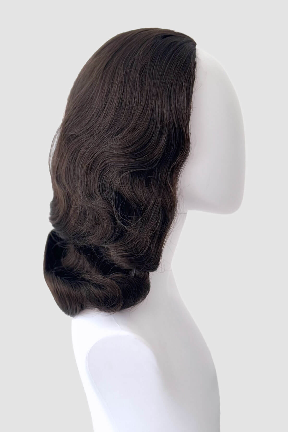 Brown wig on a mannequin head against a white background. 1940s style half wig hairpiece with beautiful marcel waves: Virginia chestnut brown 8