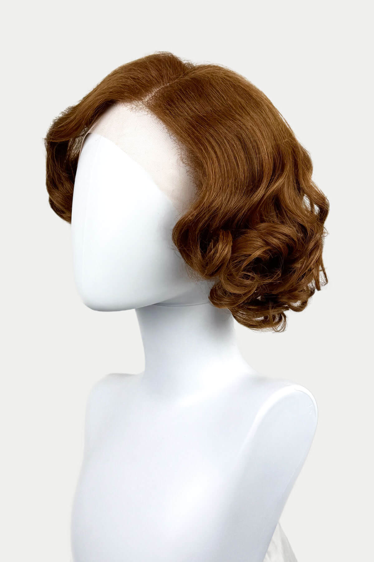 Auburn brown wavy wig on a mannequin head against a white background. Auburn pinup wig, lace front, vintage style: Tawney