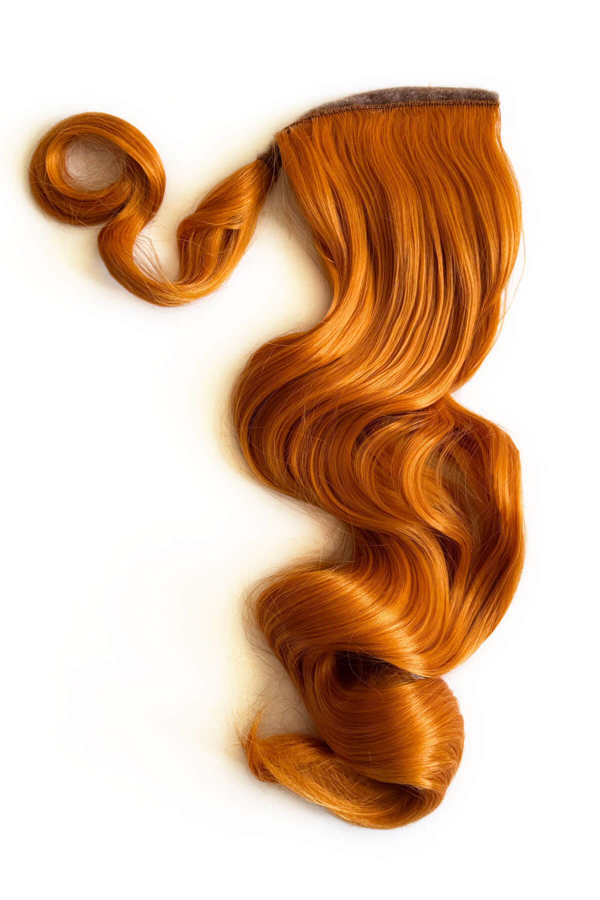 Ginger hair extension on a white background. Long ponytail hairpiece with vintage waves: Kitrysha - ginger