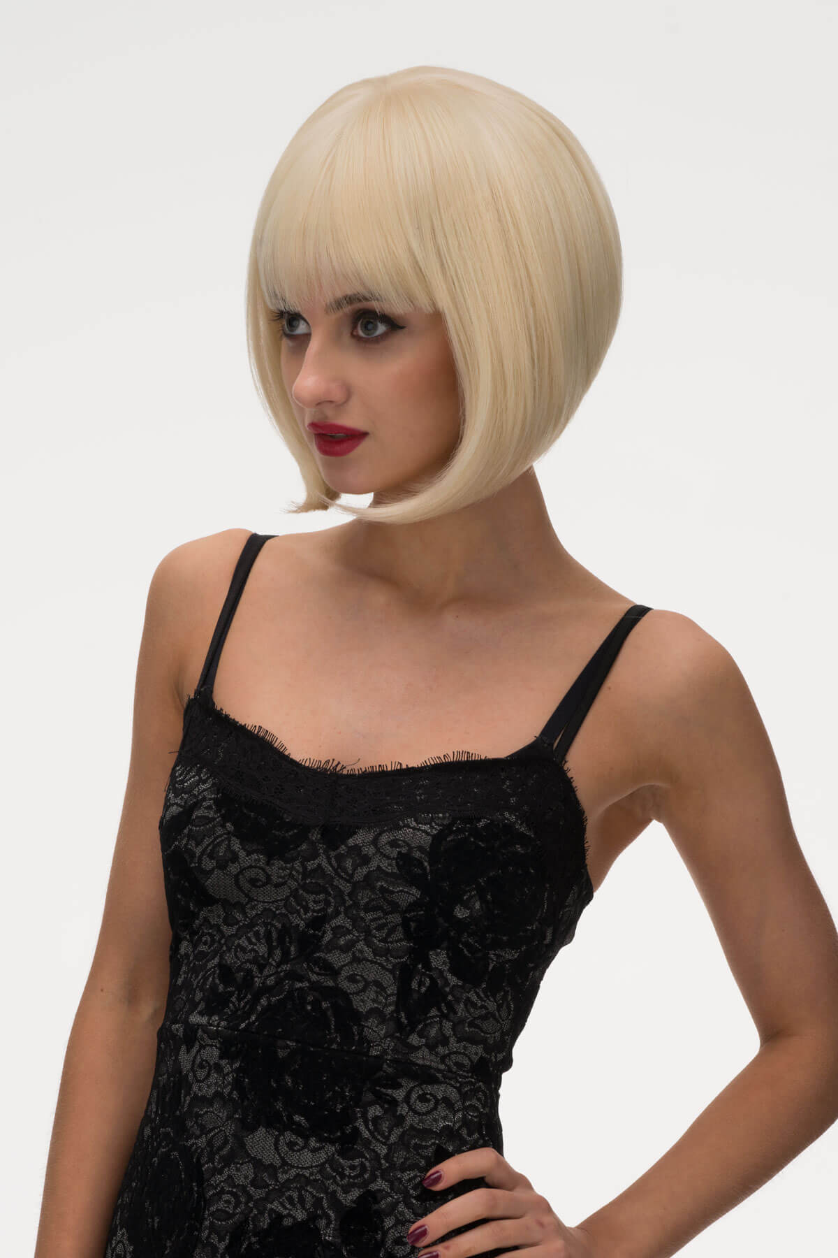 Woman with blonde bob wig on. Blonde inverted bob wig: Rhiannon champagne blonde 613