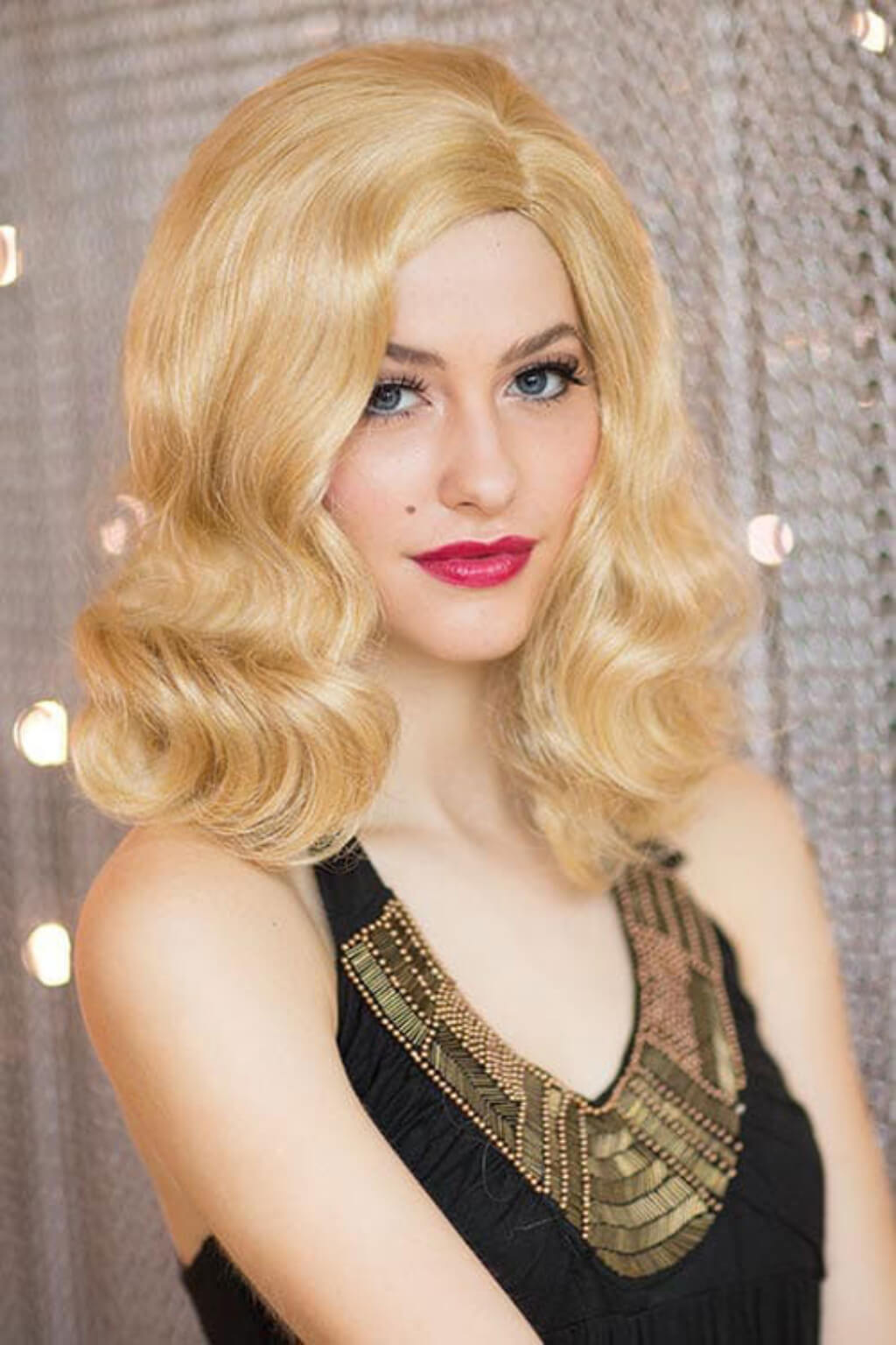 Woman with a blonde wig and black dress. 40s blonde pinup style wig with marcel waves: Lauren