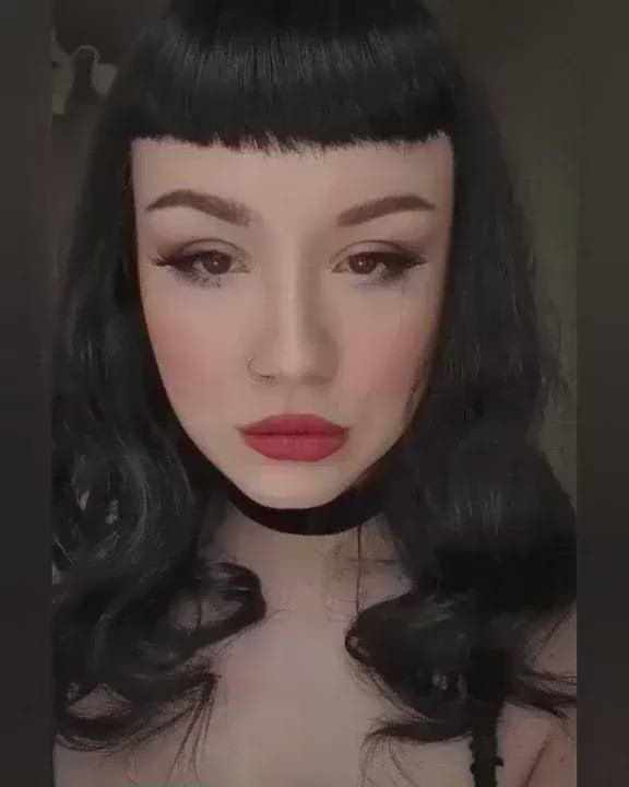 video of Bettie Page style black wig with gentle retro waves