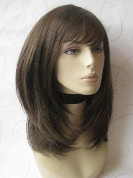 Chocolate brown wig with blonde highlights, face frame style: Katie