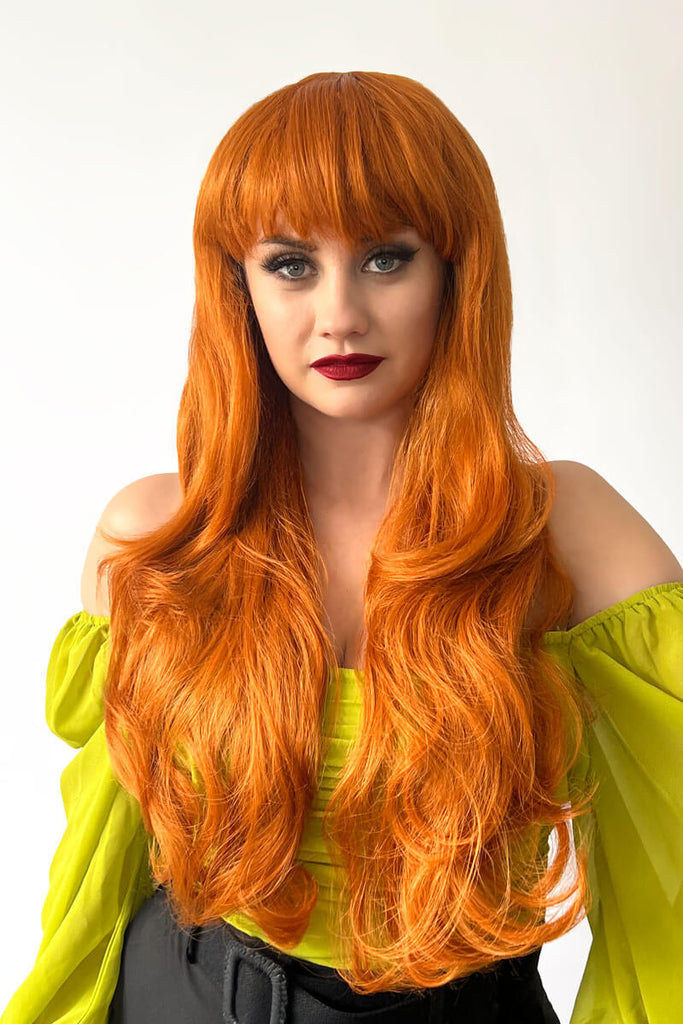 Long wavy ginger wig with vintage-style straight fringe: Coral
