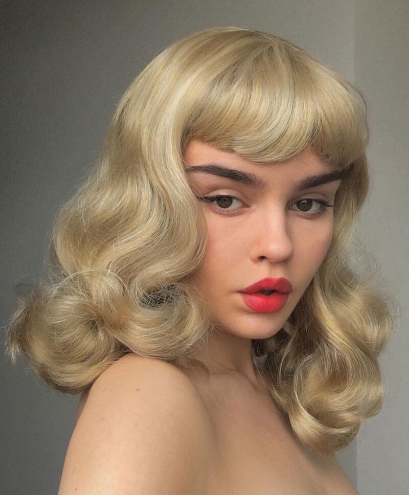 Blonde pinup wig, curled with short fringe, 1950s style: Cora